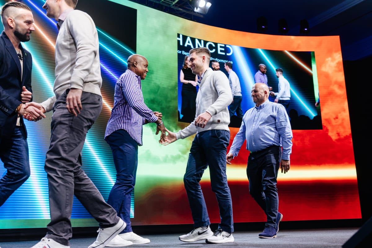 Thomas on stage at a Microsoft community event.